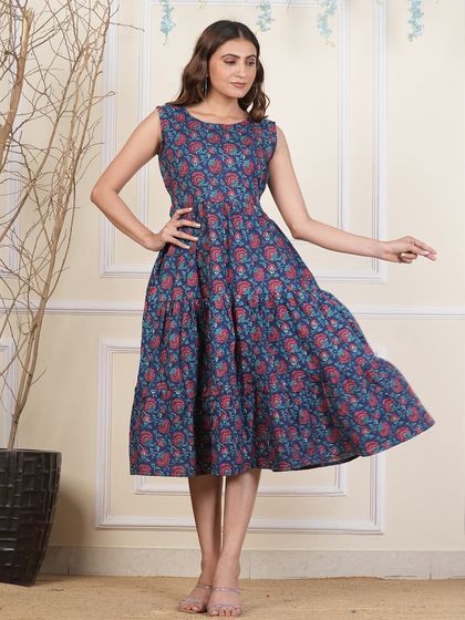 A deep indigo version of my tiered cotton dress, featuring a classic floral Bagru print. The sleeveless cut and 44-inch length make it a versatile choice for any casual occasion.