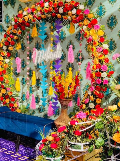 A side view highlighting the explosion of flowers and colors in this Mehndi setup. I used bright floral arrangements in the foreground to add depth to the scene.