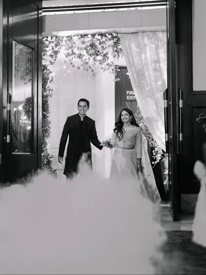 A grand entrance through a cloud of smoke. We love creating these dramatic and memorable entry moments for our couples.