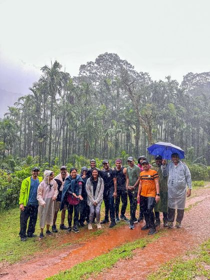 Our group huddled together in the rain, still all smiles, on the Kodachadri trail.