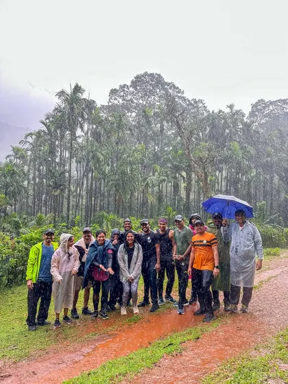 Our group huddled together in the rain, still all smiles, on the Kodachadri trail.