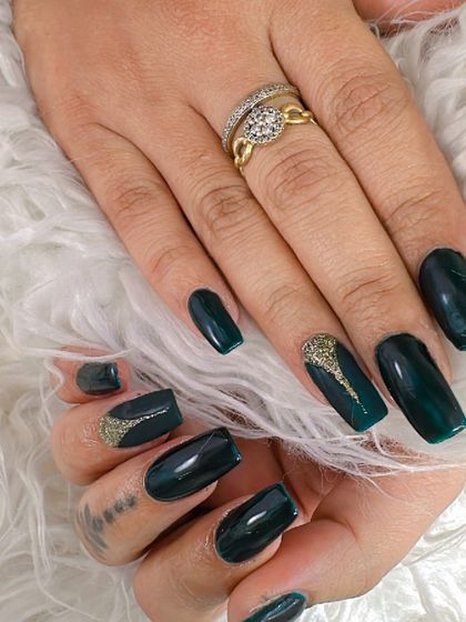 A stunning deep teal color with a subtle gold glitter accent. This color is so rich and luxurious.
