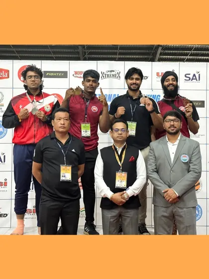 The team on the podium at the 2023 Kickboxing Nationals. We train hard, compete as a team, and celebrate our victories together.