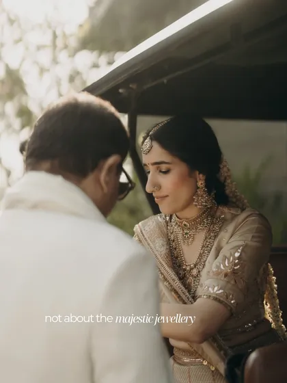 A bride in a quiet moment with her father. This image illustrates our philosophy of 'Context before Couture', focusing on personal moments and details that hold meaning beyond the wedding day.