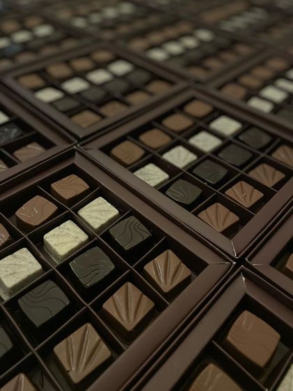 An array of our 16-piece truffle boxes, showcasing different flavors and textures. A perfect choice for corporate gifting or large family celebrations.