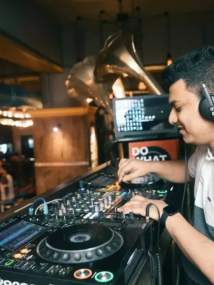 Even when I'm focused on the mix, I'm always feeling the party's vibe. A great DJ set is a balance of technical skill and pure fun. Here I am at Mitron, spinning a mix of Bollywood and hip hop to keep the night alive.