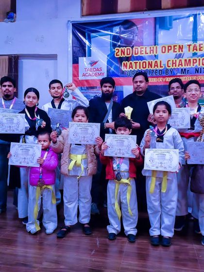 Our team proudly displays their medals and certificates after competing in the 2nd Delhi Open Taekwondo National Championship.