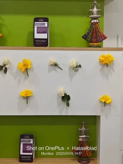 A minimalist wall decoration using individual fresh flowers. This is a subtle yet beautiful way to add color and life to an office or clinic wall for a special occasion.