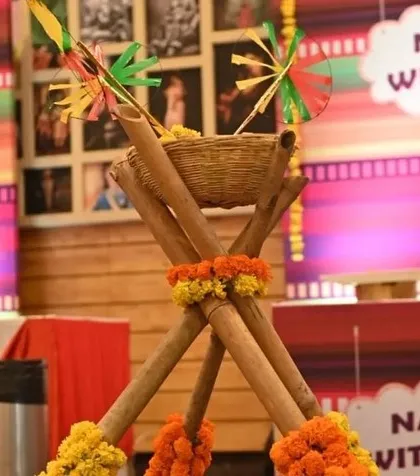 Even the food stations get a decorative touch. For this Haldi, I used bamboo stands and marigold flowers to create themed counters for snacks like nachos and crispy corn, integrating them into the overall decor.