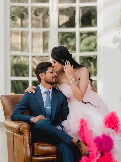 A tender moment captured in a beautiful indoor setting. The groom's adoring kiss on the forehead and the bride's stunning gown make this a classic romantic portrait from their Picture Villa shoot.