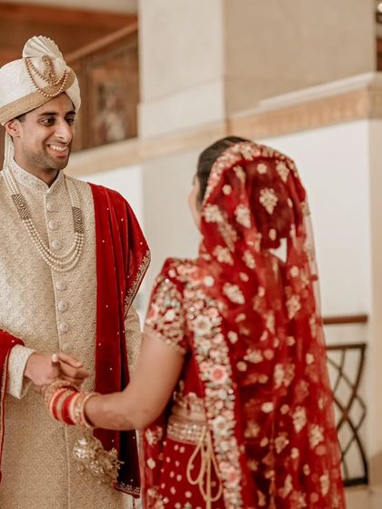 The first look. The groom's happy and loving expression as he sees his bride for the first time on their wedding day.