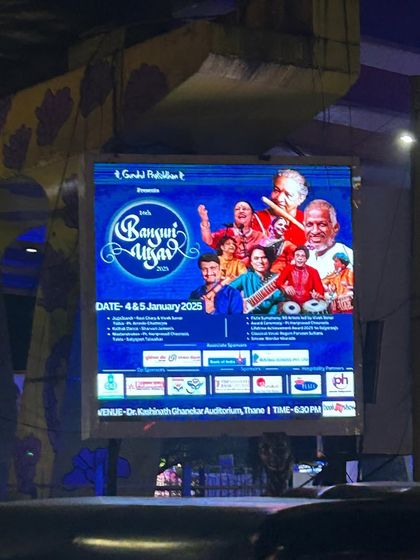 A billboard for the 16th Bansuri Utsav, a celebration of timeless music, seen on the streets of Thane.