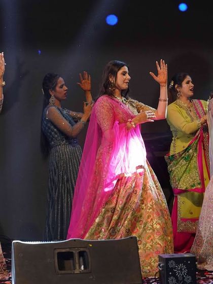 A group of ladies from the family performing a graceful and coordinated routine. We specialize in creating beautiful formations and simple steps that look stunning on stage.