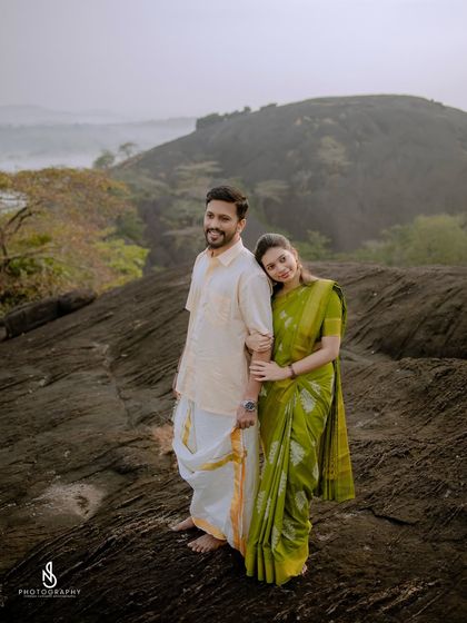 A classic couple portrait, with her leaning on his shoulder, showcasing their comfortable and easy connection.