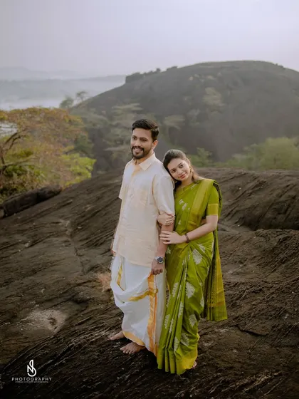 A classic couple portrait, with her leaning on his shoulder, showcasing their comfortable and easy connection.