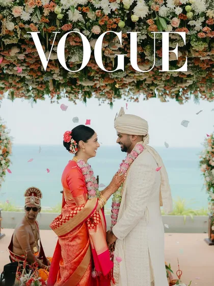 Featured in Vogue India, this shot captures the beautiful fusion of Tamil and Maharashtrian traditions at a coastal wedding in Sri Lanka. The vibrant colors of the bride's Kanjeevaram sari pop against the serene ocean backdrop.