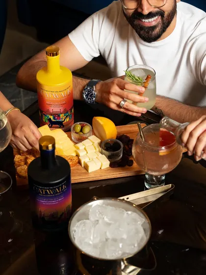 This lifestyle shot shows the product in a social setting. By focusing on the shared experience of pouring drinks and enjoying a cheese board, I created an aspirational scene that makes the gin brand feel connected to good times with friends.