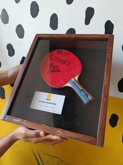 A duplicate of 109, we also crafted this unique wooden shadow box to hold a table tennis paddle autographed by the young star Diya Chitale.