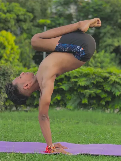 Finding balance in a scorpion handstand. Yoga teaches us to find this balance in all parts of life, not just on the mat.