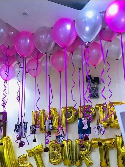 One of my most requested features is adding photos to the balloon decorations. Here, I've attached pictures to the ribbons of the ceiling balloons for a personalized birthday surprise.