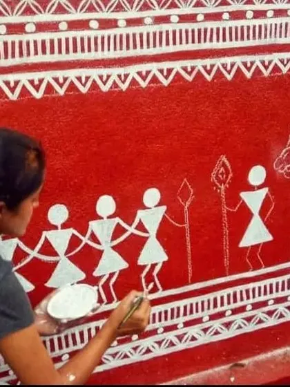 Here I am, in my element, hand-painting a traditional Warli art piece. This art form requires precision and a deep respect for the craft. It shows my commitment to preserving cultural art while creating beautiful spaces for my clients.