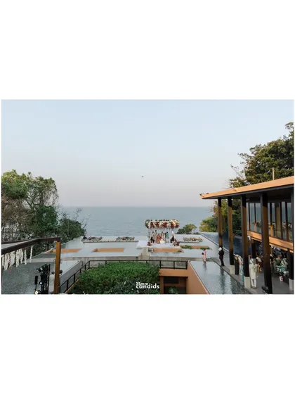 A wide-angle shot showing the stunning Baba Nest rooftop venue at Sri Panwa, capturing the incredible 360-degree view of the Andaman Sea during the ceremony.
