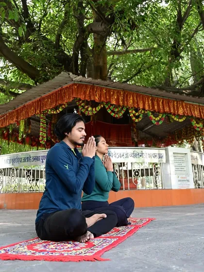 Praying and setting an intention before practice. This connects the physical movement to a deeper spiritual purpose.