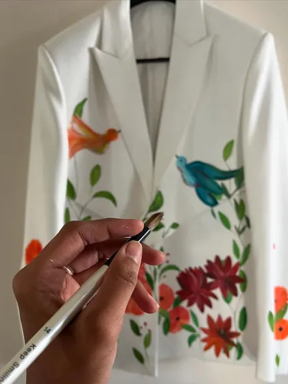 A glimpse of a few recent works on fabric. This jacket features colorful birds and florals, showcasing my love for nature-inspired themes.
