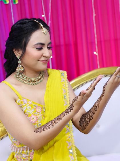 A side view showing the partial mehndi design, perfect for guests or bridesmaids.