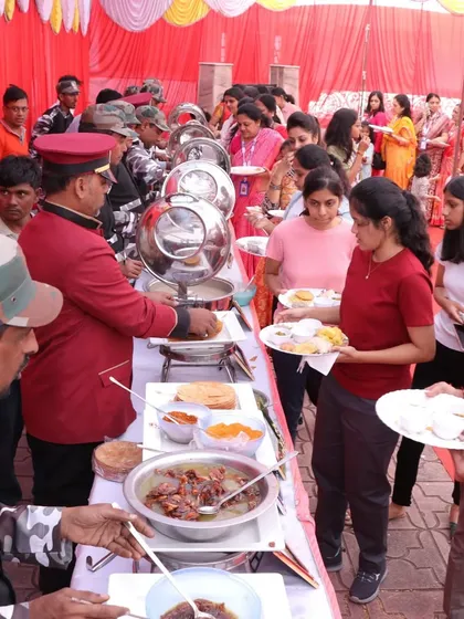 Our team serving guests at a large community event. We are equipped to handle events of any size, ensuring every guest receives prompt and courteous service.