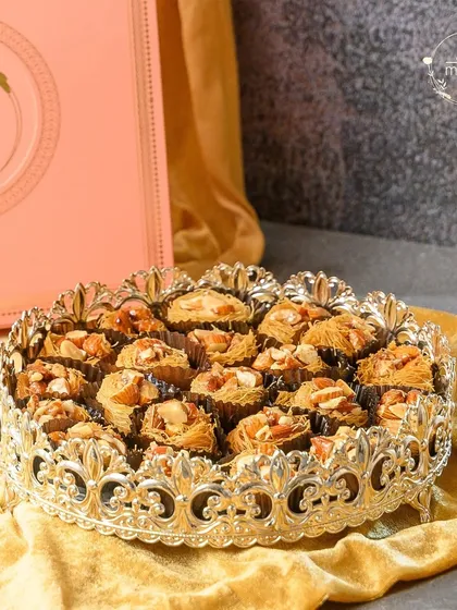A feast for the eyes and a delight for the palate. This platter of handcrafted gourmet baklava, presented in my signature style, is perfect for Eid and other festive celebrations.