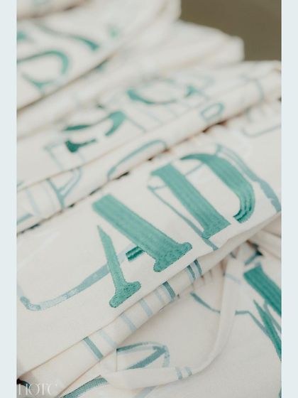 A close-up of the custom-printed aprons, showcasing the personalized touch we bring to every event.