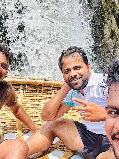 Enjoying a coracle boat ride with friends right next to one of the smaller cascades at Hogenakkal. It's an unforgettable experience.