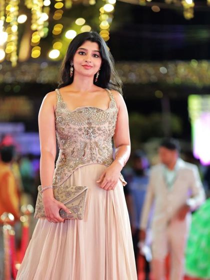 A full-length view of Aishani Shetty's graceful peplum gown.