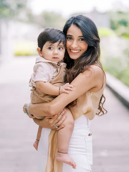 A mother and son portrait from the same session. The custom-made outfit for the little boy adds a unique, personal touch.