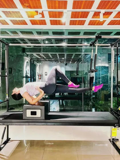 Limit none. This side plank hover on the Cadillac challenges the entire core and showcases incredible strength and stability.