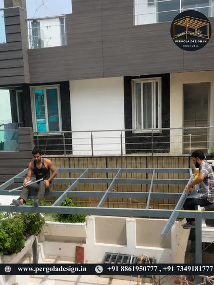 Our skilled team at work, installing the framework for a glass pergola. We handle every aspect of the project, ensuring quality and safety from start to finish.