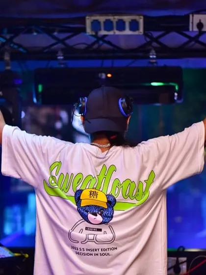 A view from the back with my hands up. This pose is all about embracing the extraordinary moments that music creates.