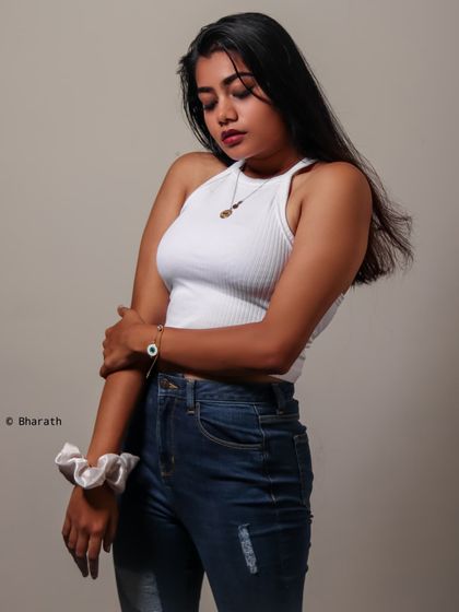 A relaxed and natural pose in the studio. The clean lighting and simple styling make for a timeless and versatile portrait.