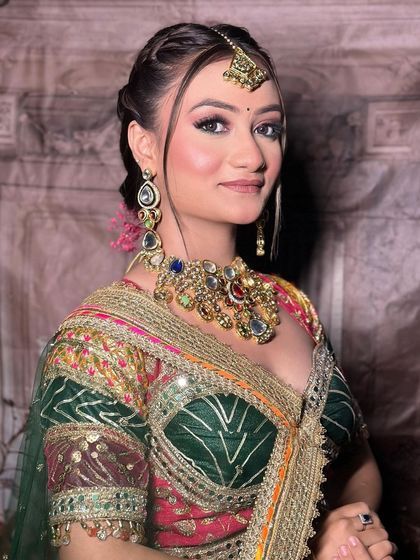 A makeup artist's work on a model wearing our multi-color Navratri lehenga. The close-ups on the makeup are perfect for an MUA's social media.