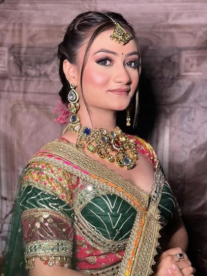 A makeup artist's work on a model wearing our multi-color Navratri lehenga. The close-ups on the makeup are perfect for an MUA's social media.