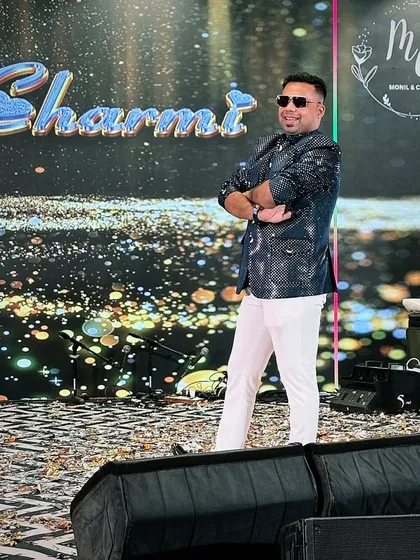 Another shot of my confident, arms-crossed pose on stage. It shows I'm in control and ready to deliver a fantastic show for my clients.