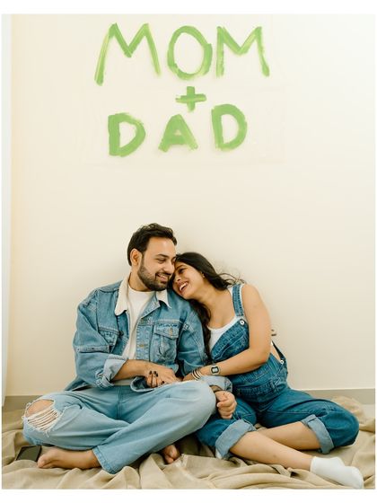 Officially 'Mom + Dad'! This happy portrait captures the excitement and joy of sharing their news with the world.