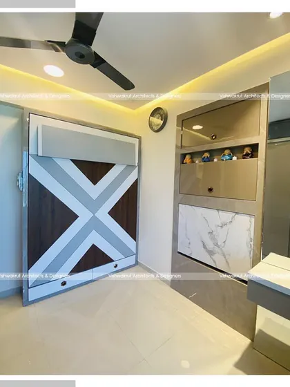 The kid's bedroom with the wall-mounted bed in its folded-up position. This shows the geometric design on the front panel, which makes it look like a decorative wall feature when not in use.