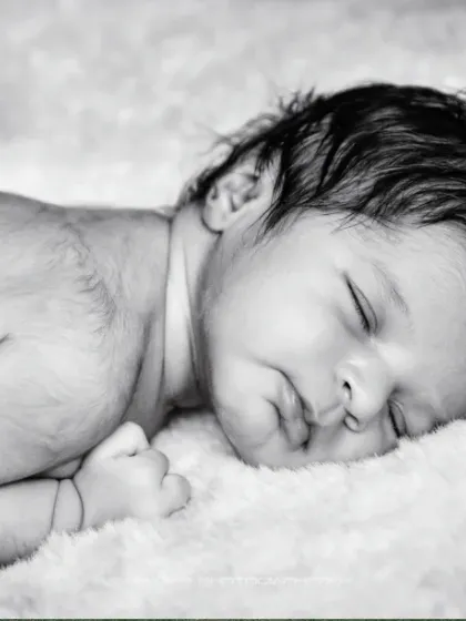 A classic black and white. This simple, peaceful portrait of a sleeping baby on a soft, fluffy blanket is absolutely timeless.