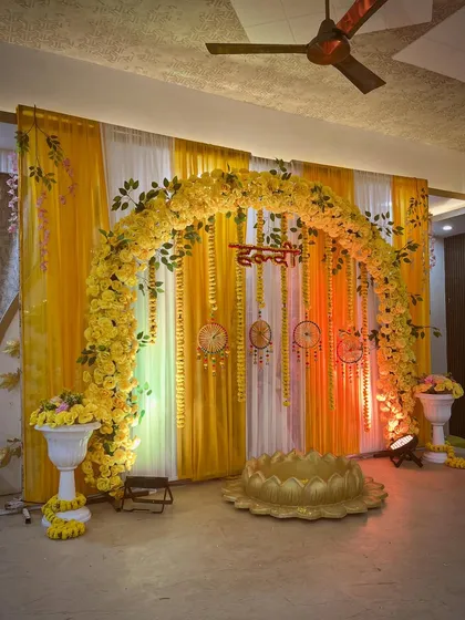 A side view of the elegant floral arch for the Haldi ceremony.
