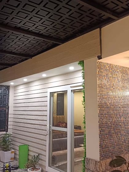 Another angle of the completed Najafgarh site, showing the detailed textures of the pergola roof, wall cladding, and mosaic tiles.