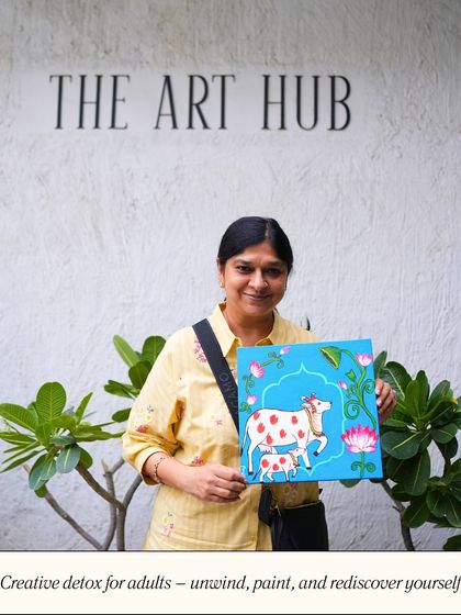 I offer a creative detox for adults to unwind, paint, and rediscover themselves. This student is showcasing her beautiful traditional Indian cow painting, created during a relaxing session at the studio.