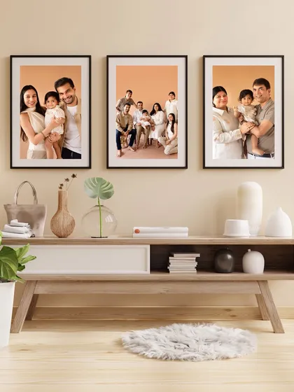 Another example of a stunning gallery wall, showcasing a variety of family portraits from a single session.