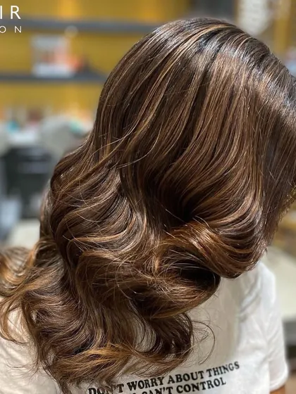 A closer look at these beautiful chocolate tones. The soft waves showcase the dimension and shine of the new colour.